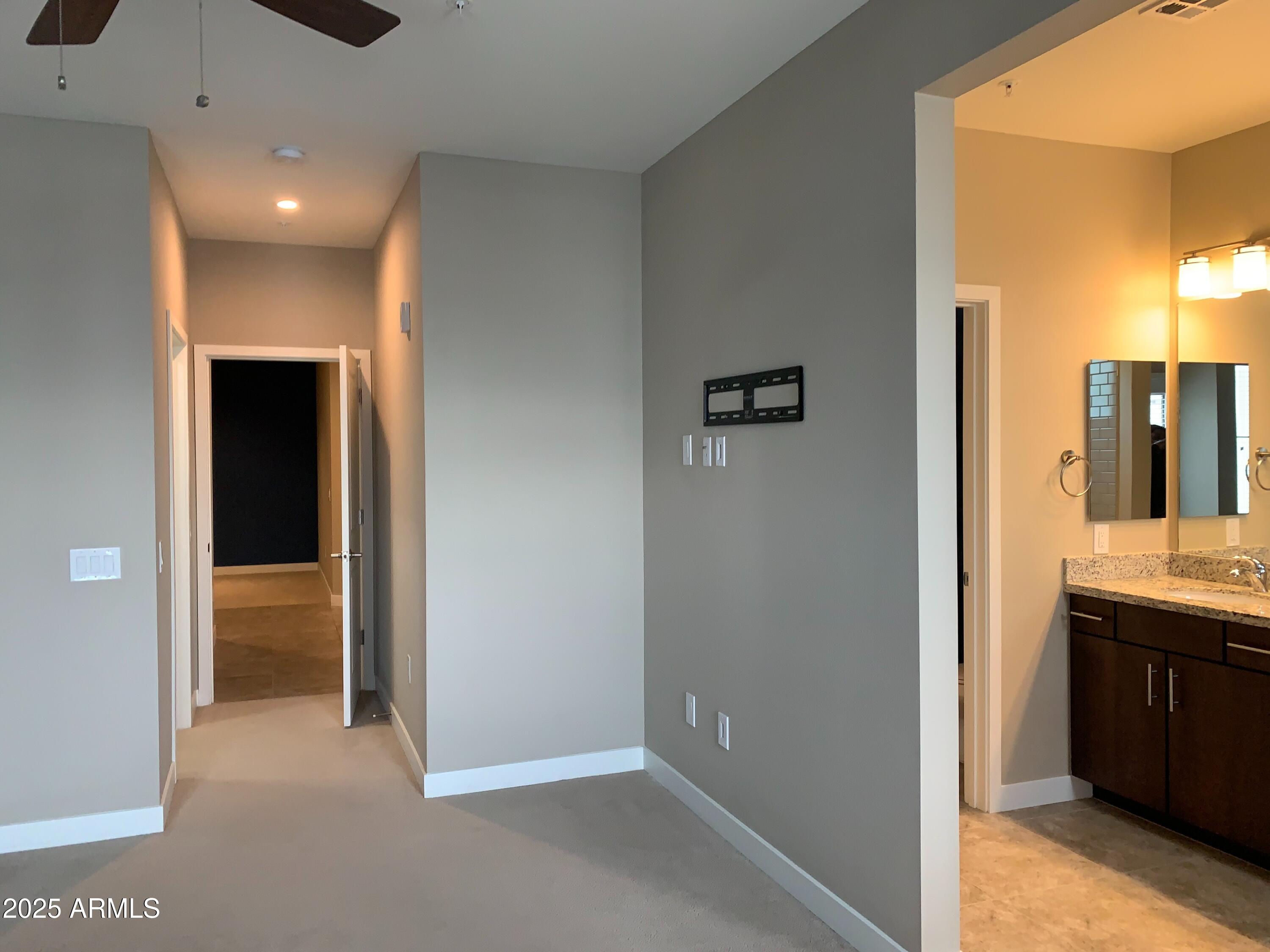 2511 West Queen Creek Road, Unit 326 Chandler, AZ 85248 - Photo 15 of 32 a view of a bathroom from a hallway