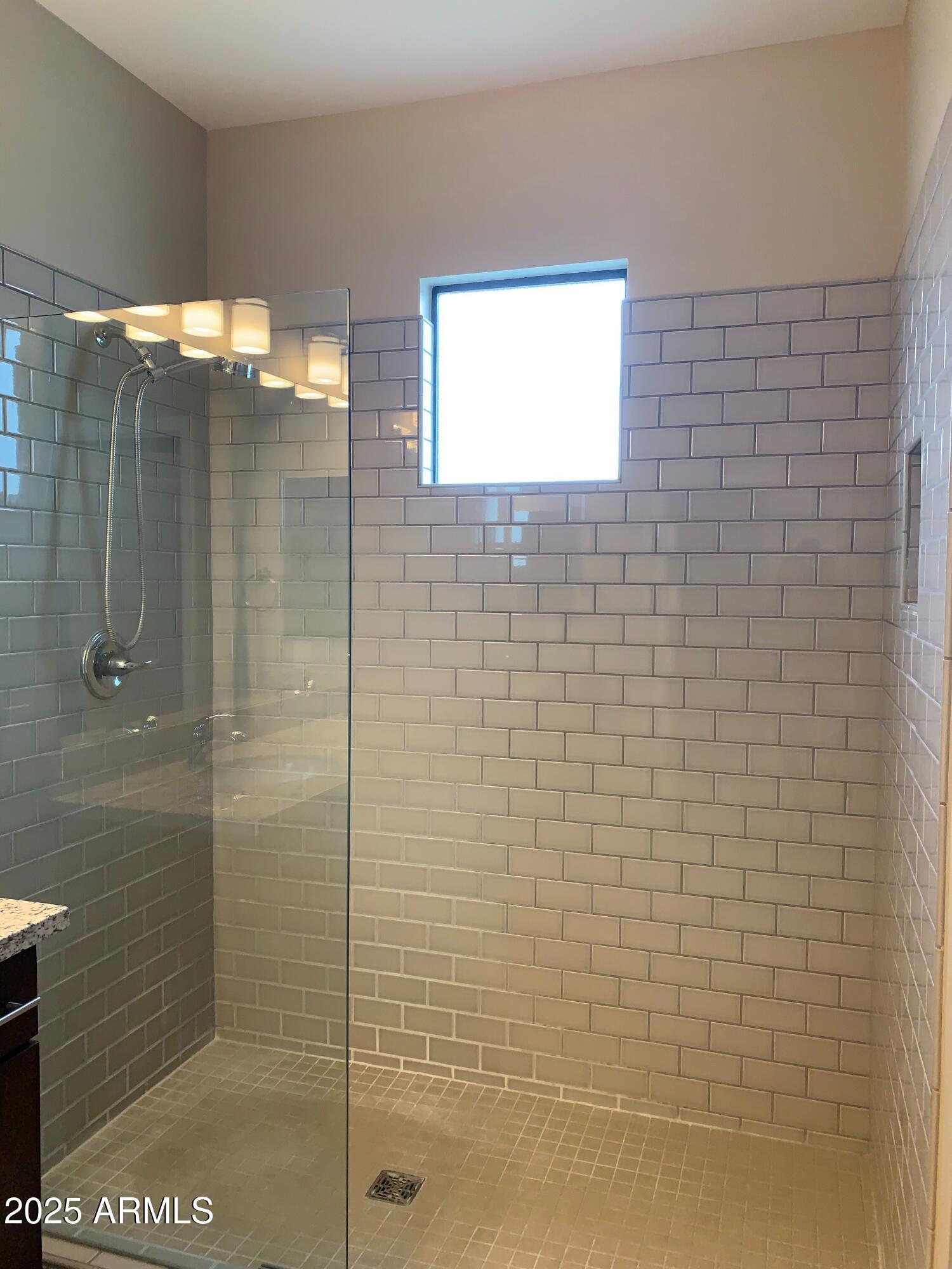 2511 West Queen Creek Road, Unit 326 Chandler, AZ 85248 - Photo 19 of 32 a bathroom with a shower