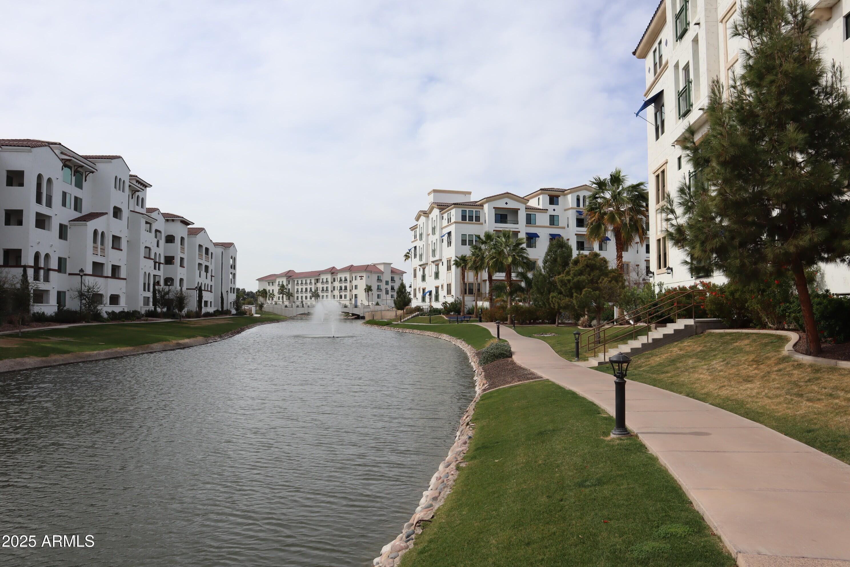 2511 West Queen Creek Road, Unit 326 Chandler, AZ 85248 - Photo 2 of 32 a view of a city street with tall buildings