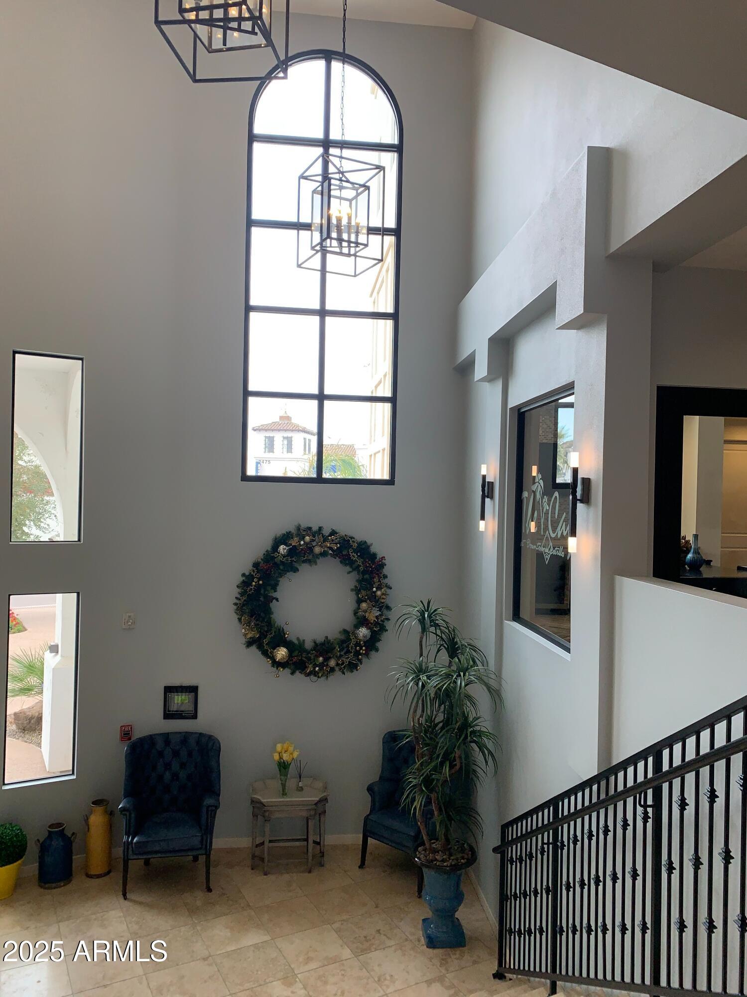 2511 West Queen Creek Road, Unit 326 Chandler, AZ 85248 - Photo 24 of 32 a living room with furniture and a large window