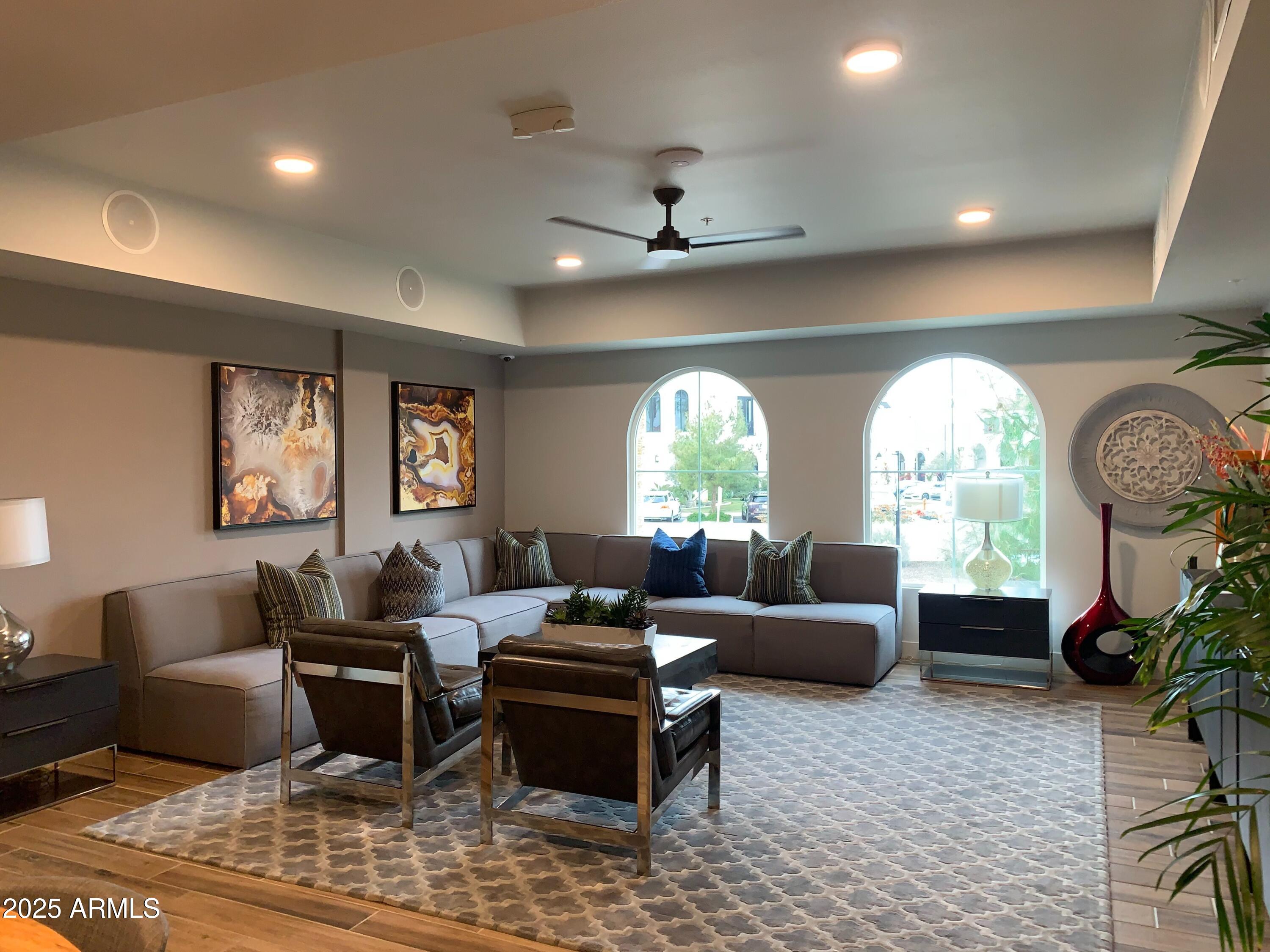 2511 West Queen Creek Road, Unit 326 Chandler, AZ 85248 - Photo 25 of 32 a living room with furniture chandelier and a large window