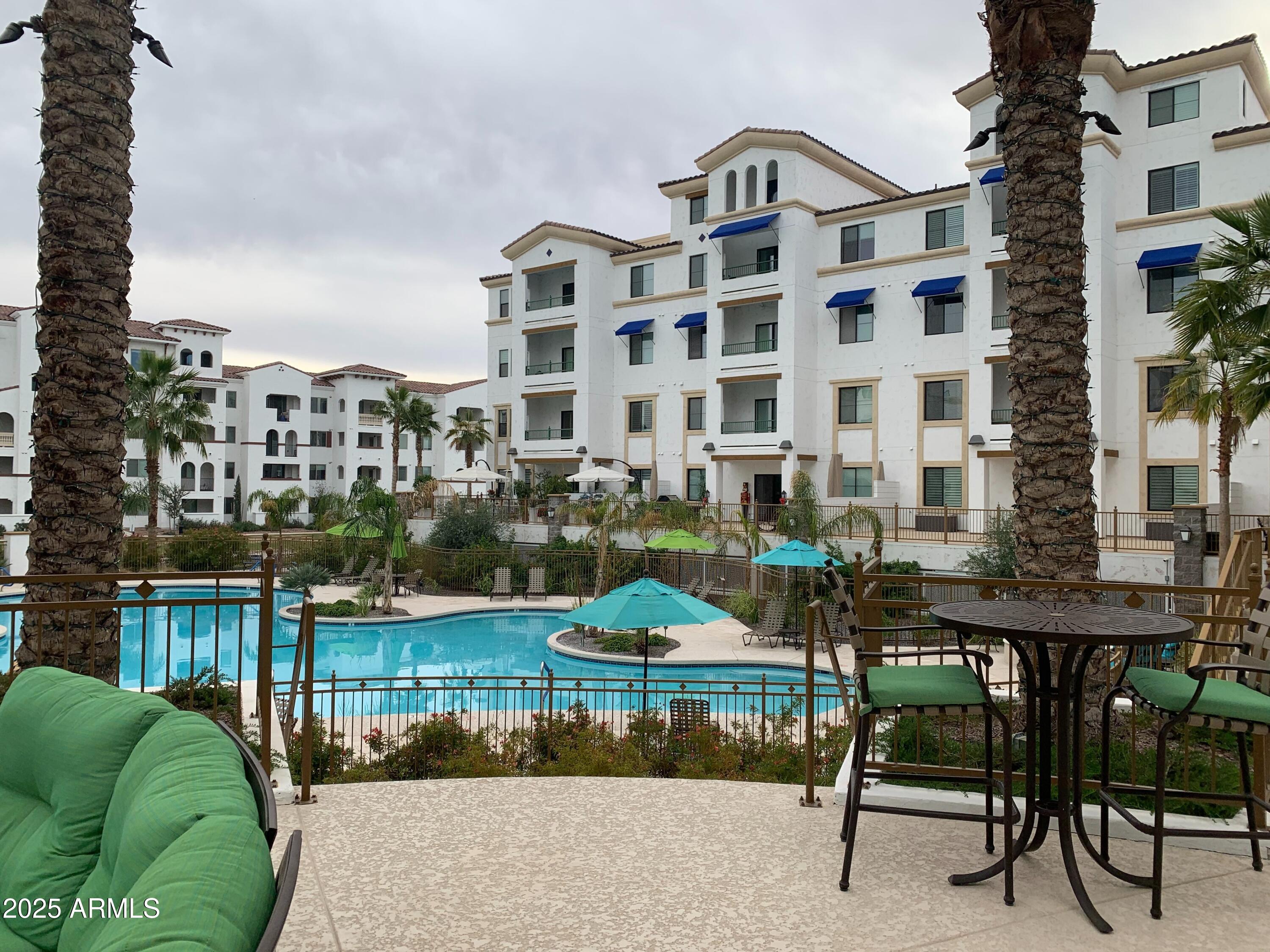 2511 West Queen Creek Road, Unit 326 Chandler, AZ 85248 - Photo 29 of 32 a front view of a building with outdoor seating