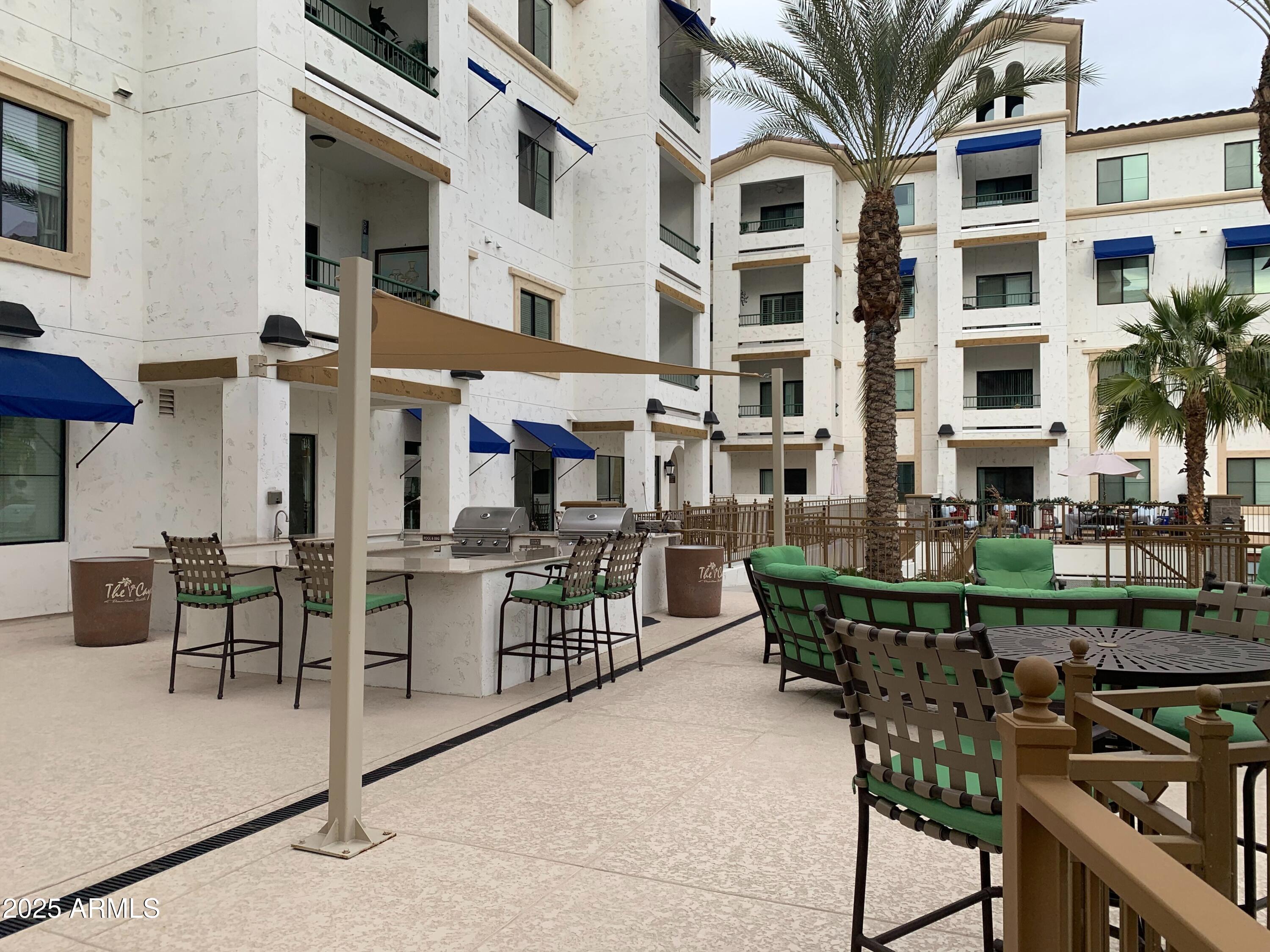 2511 West Queen Creek Road, Unit 326 Chandler, AZ 85248 - Photo 30 of 32 a front view of a building with outdoor seating