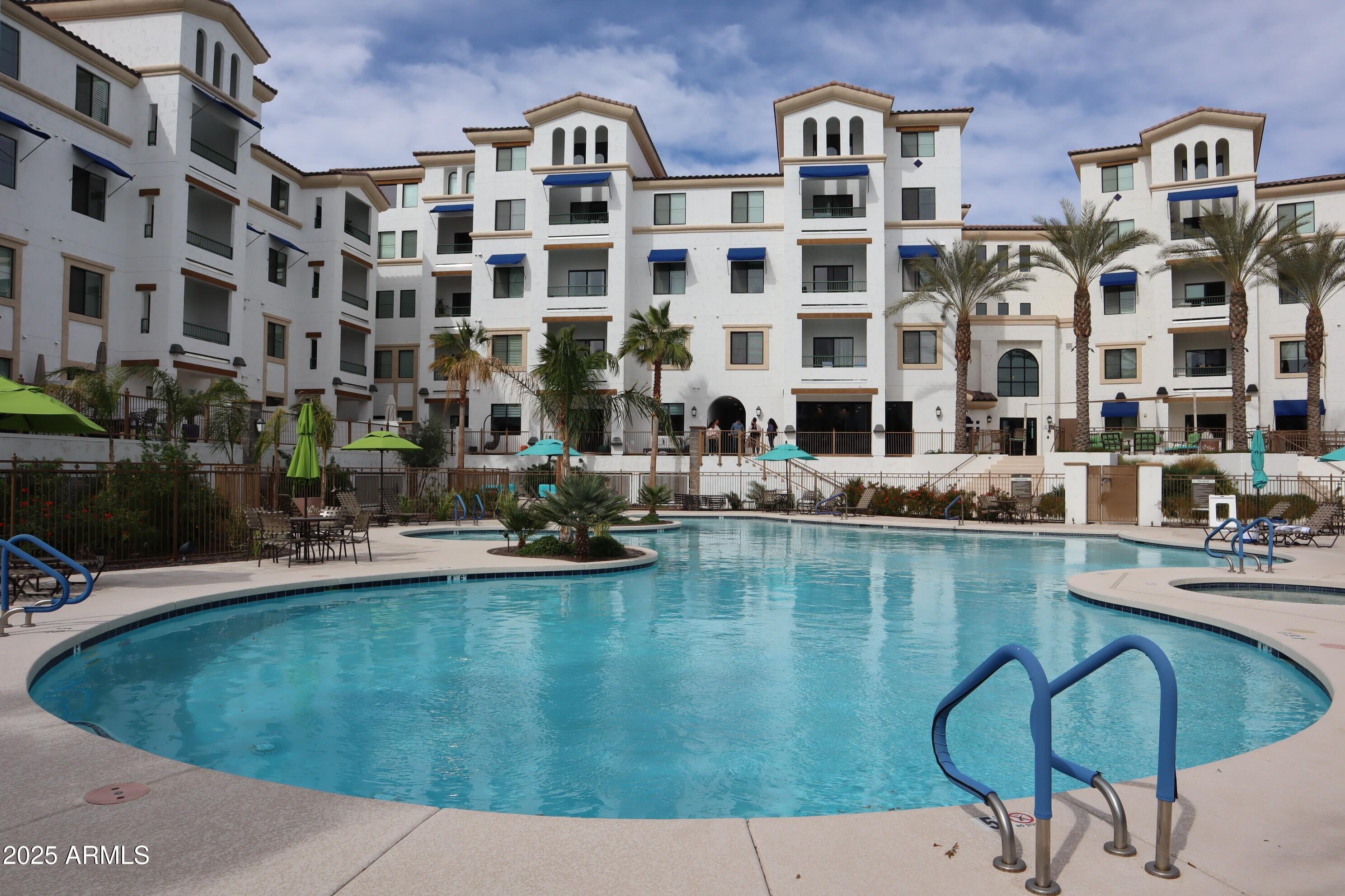 2511 West Queen Creek Road, Unit 326 Chandler, AZ 85248 - Photo 3 of 32 a view of building with outdoor space