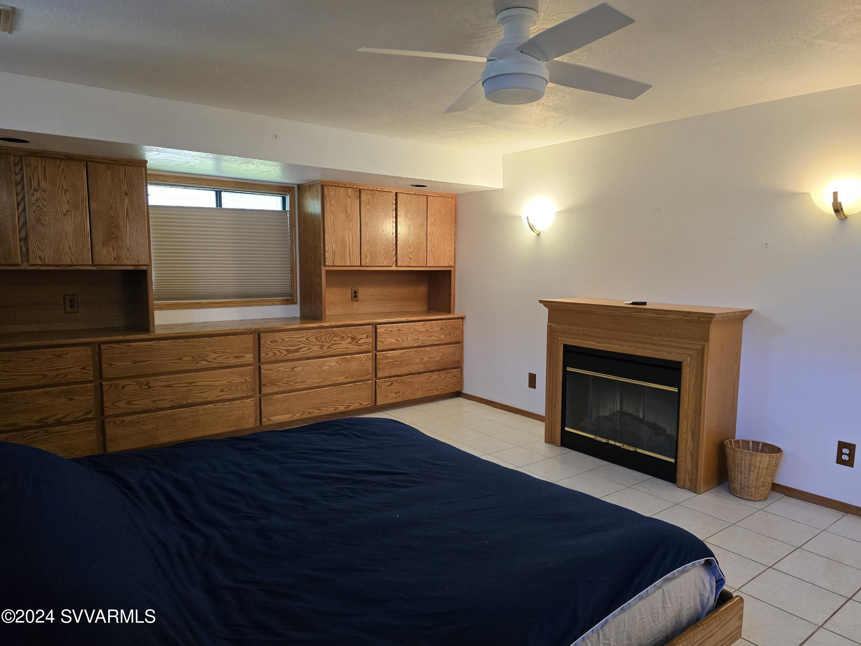 1707 Sawmill Road Cottonwood, AZ 86326 - Photo 23 of 93 a bedroom with a bed and a fireplace