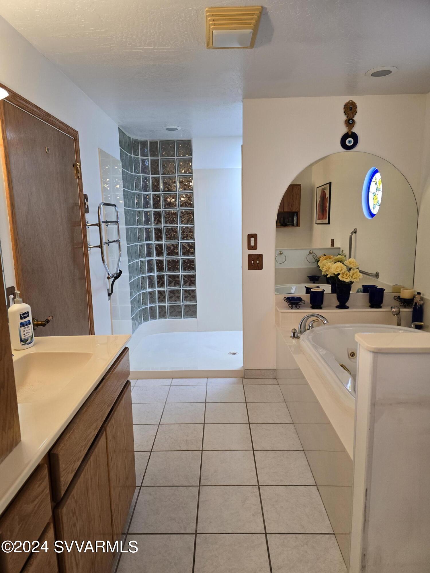 1707 Sawmill Road Cottonwood, AZ 86326 - Photo 28 of 93 a kitchen with a sink a stove and cabinets