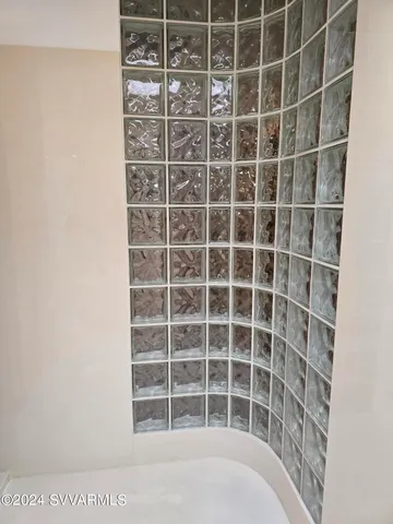 a bedroom with a bed and a desk