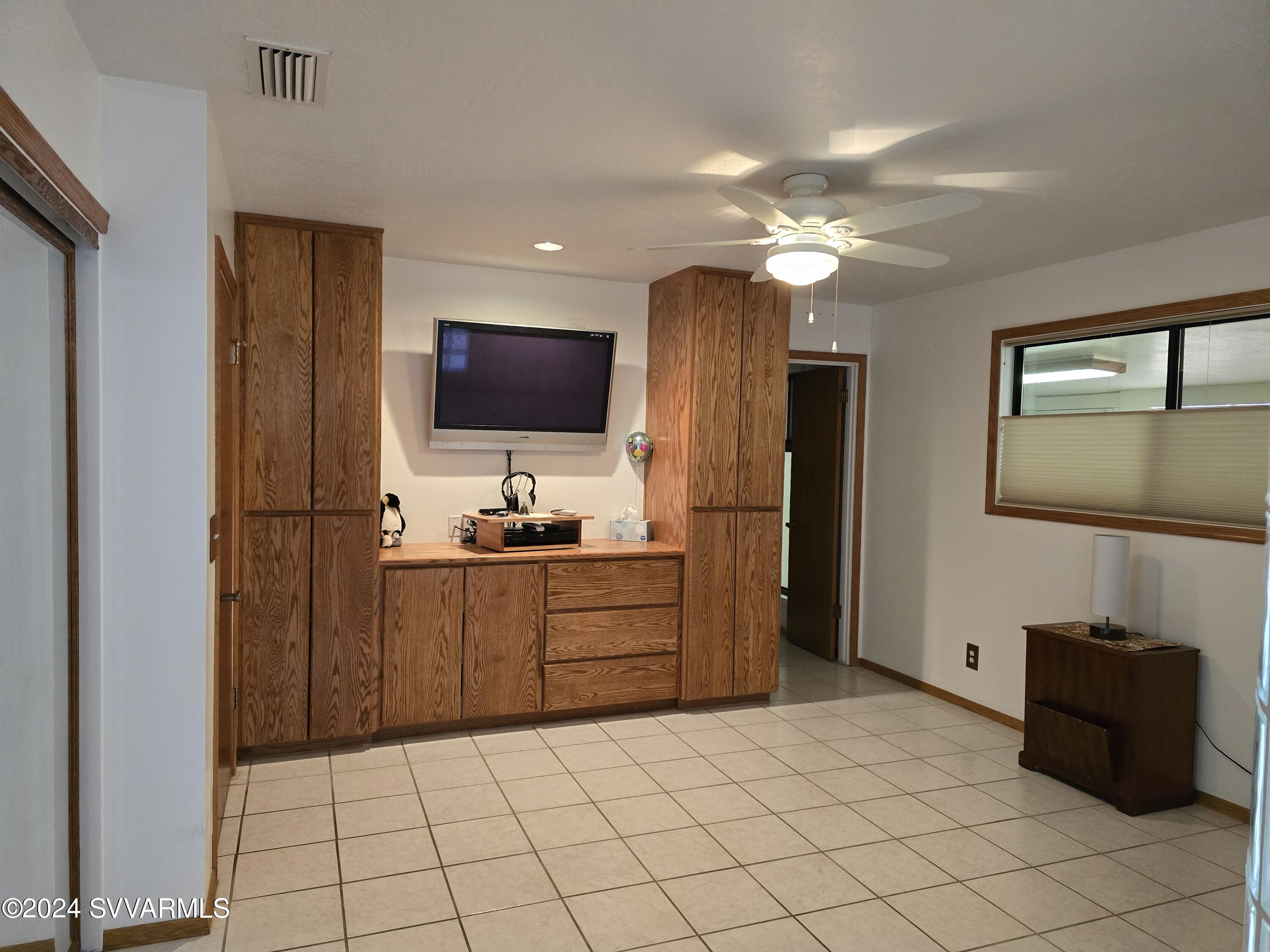 1707 Sawmill Road Cottonwood, AZ 86326 - Photo 33 of 93 a kitchen with a refrigerator and a stove top oven