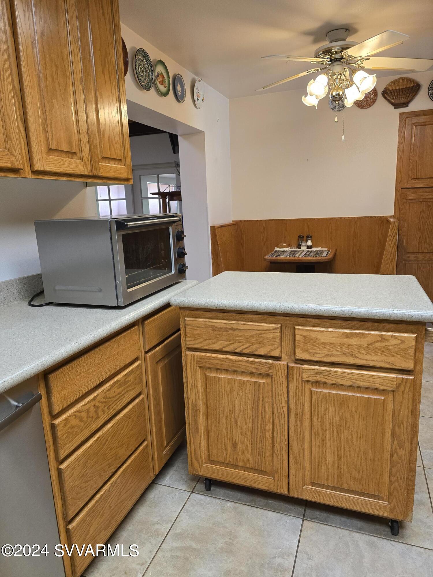 1707 Sawmill Road Cottonwood, AZ 86326 - Photo 44 of 93 a kitchen with cabinets and appliances
