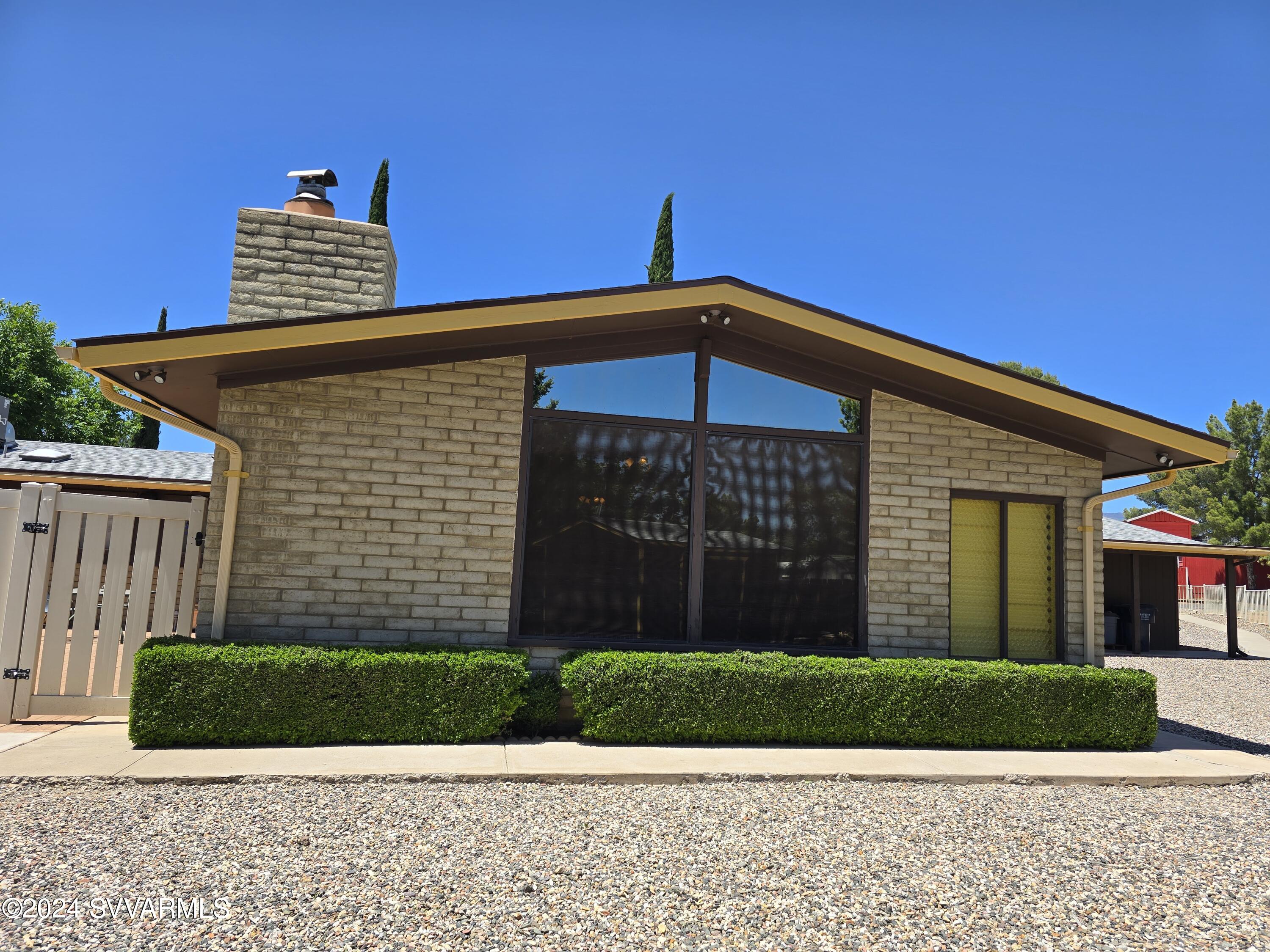 1707 Sawmill Road Cottonwood, AZ 86326 - Photo 5 of 93 a front view of a house with a garden