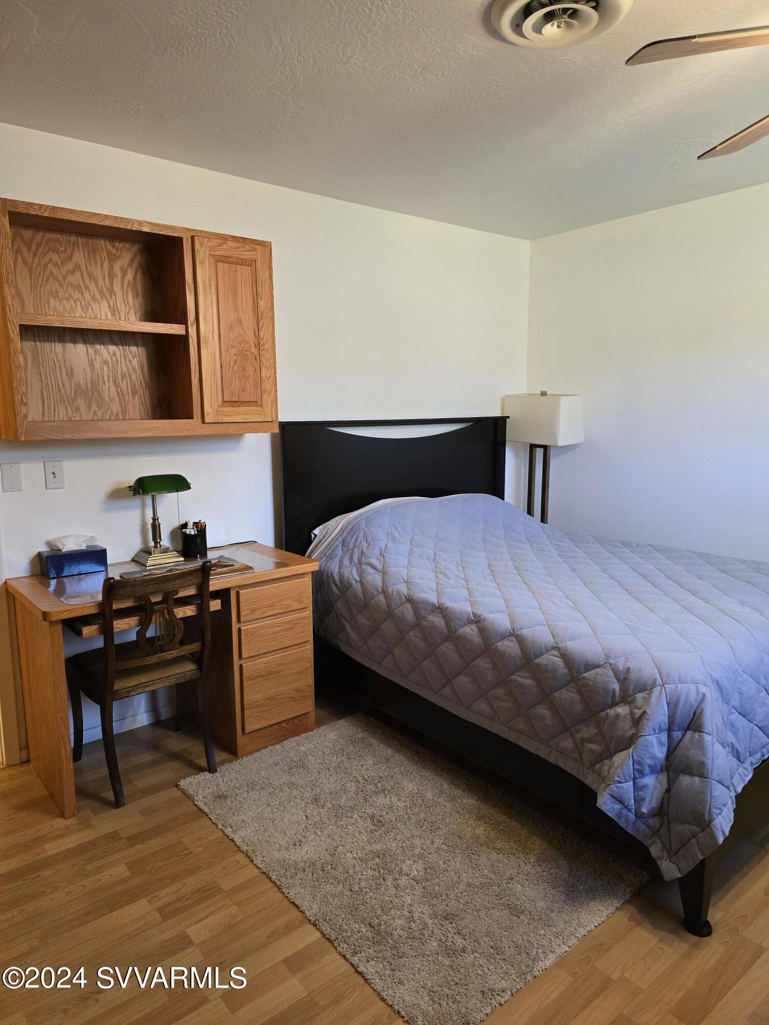 1707 Sawmill Road Cottonwood, AZ 86326 - Photo 59 of 93 a bedroom with a bed and a desk