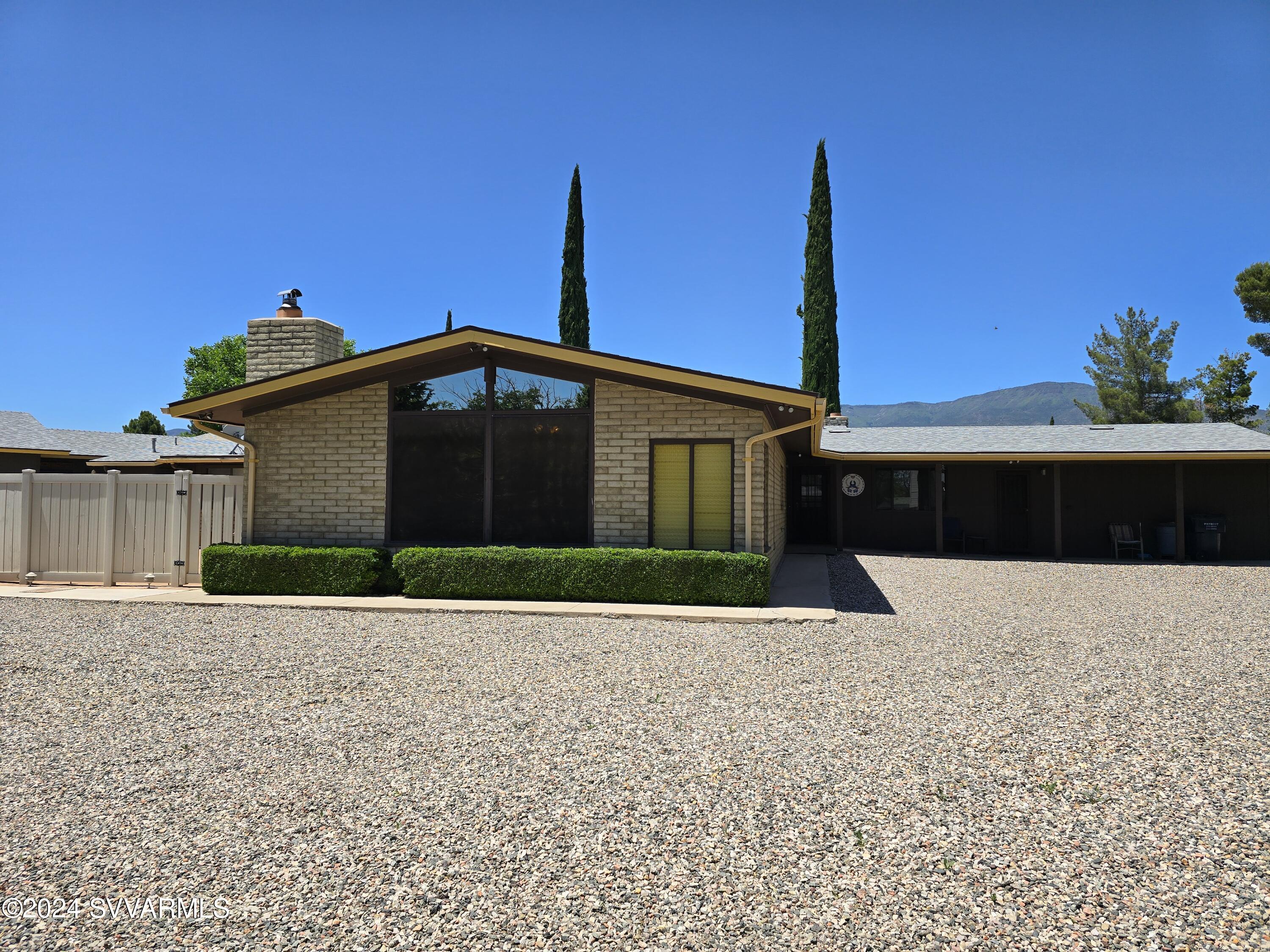 1707 Sawmill Road Cottonwood, AZ 86326 - Photo 6 of 93 a front view of a house with a yard