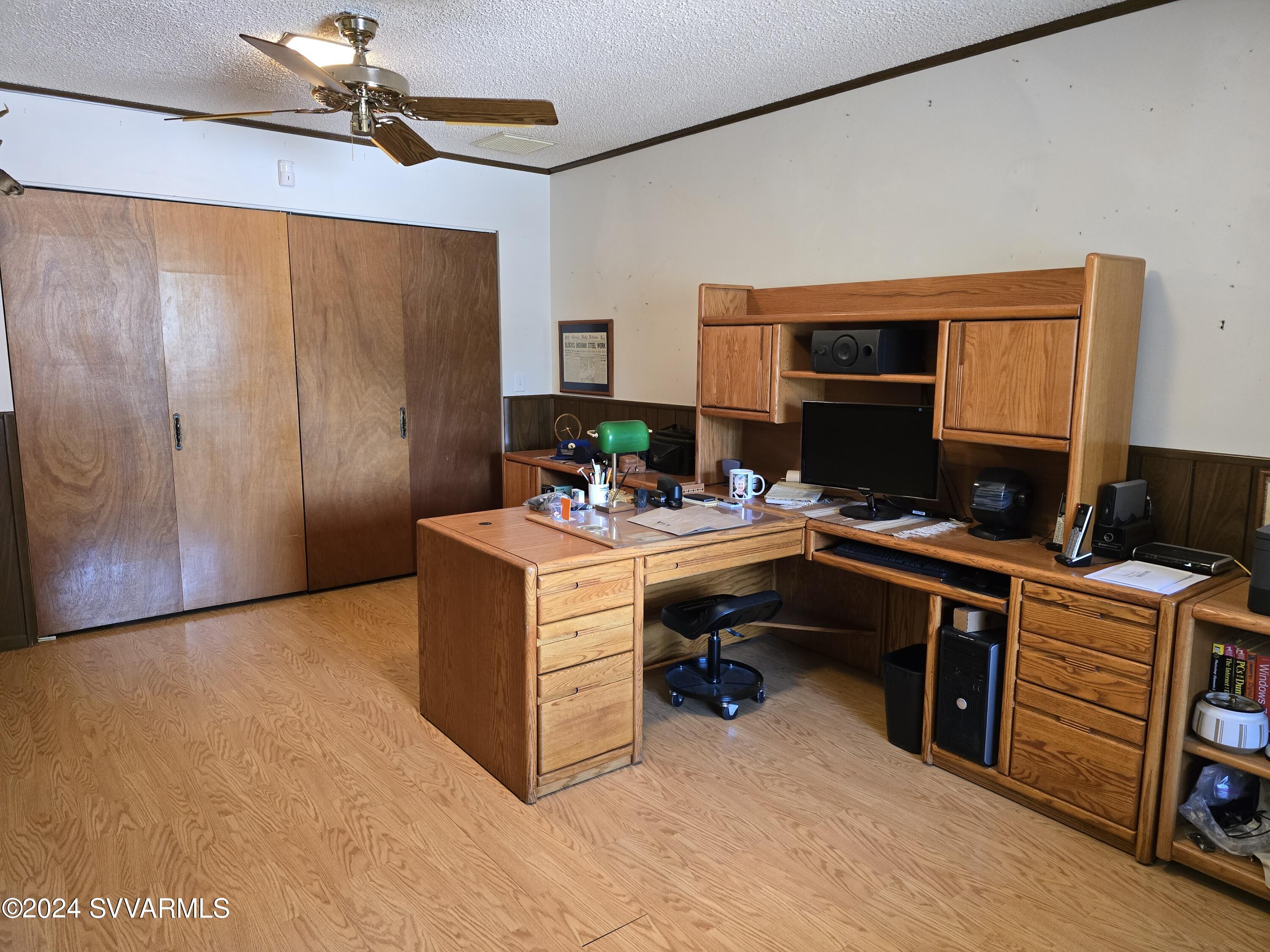 1707 Sawmill Road Cottonwood, AZ 86326 - Photo 65 of 93 a room with furniture a ceiling fan and a window