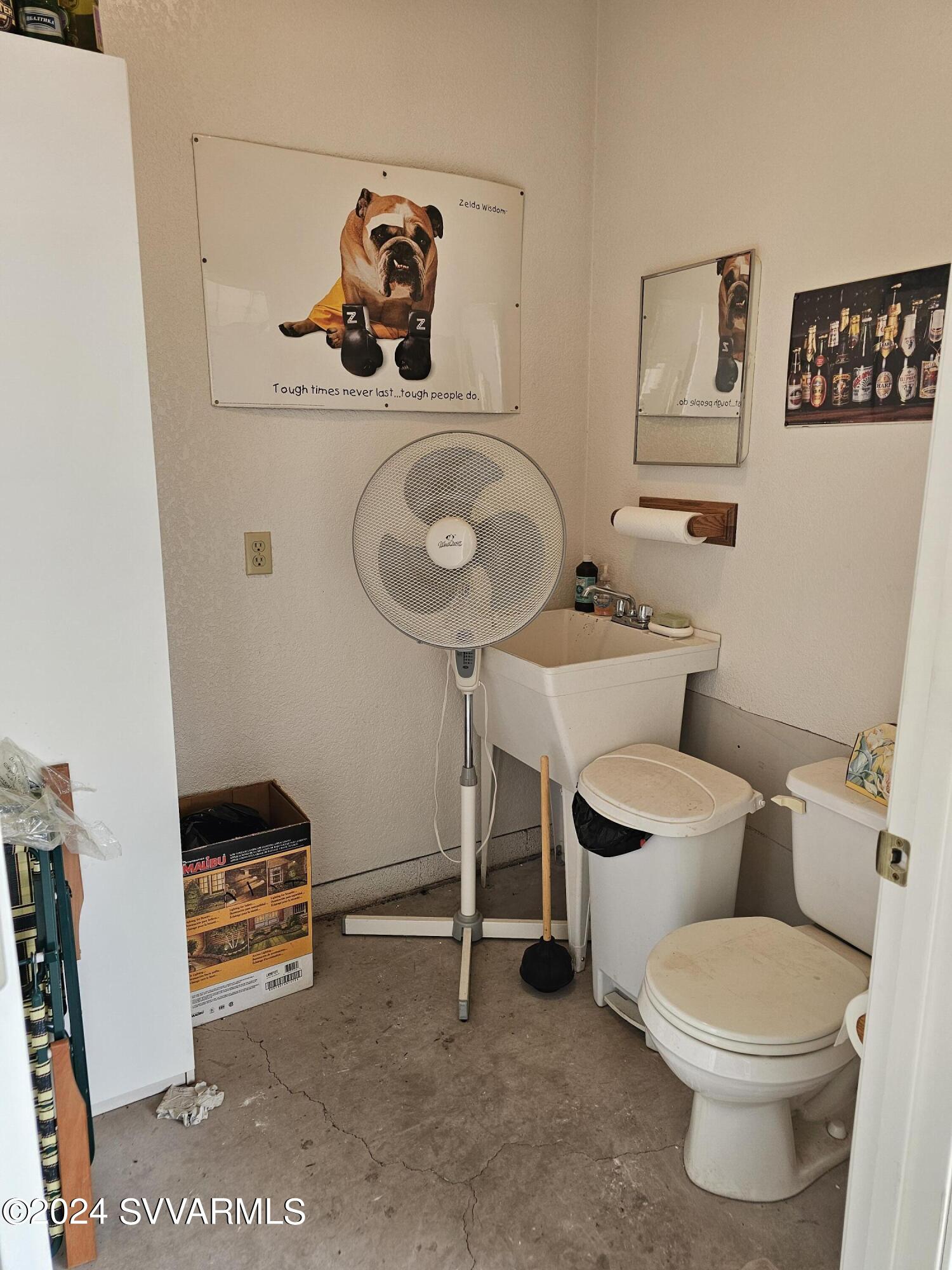 1707 Sawmill Road Cottonwood, AZ 86326 - Photo 91 of 93 a bathroom with a toilet a sink and a mirror