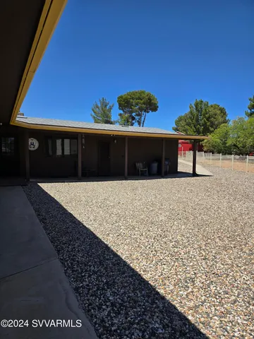 a bedroom with a bed and with furniture