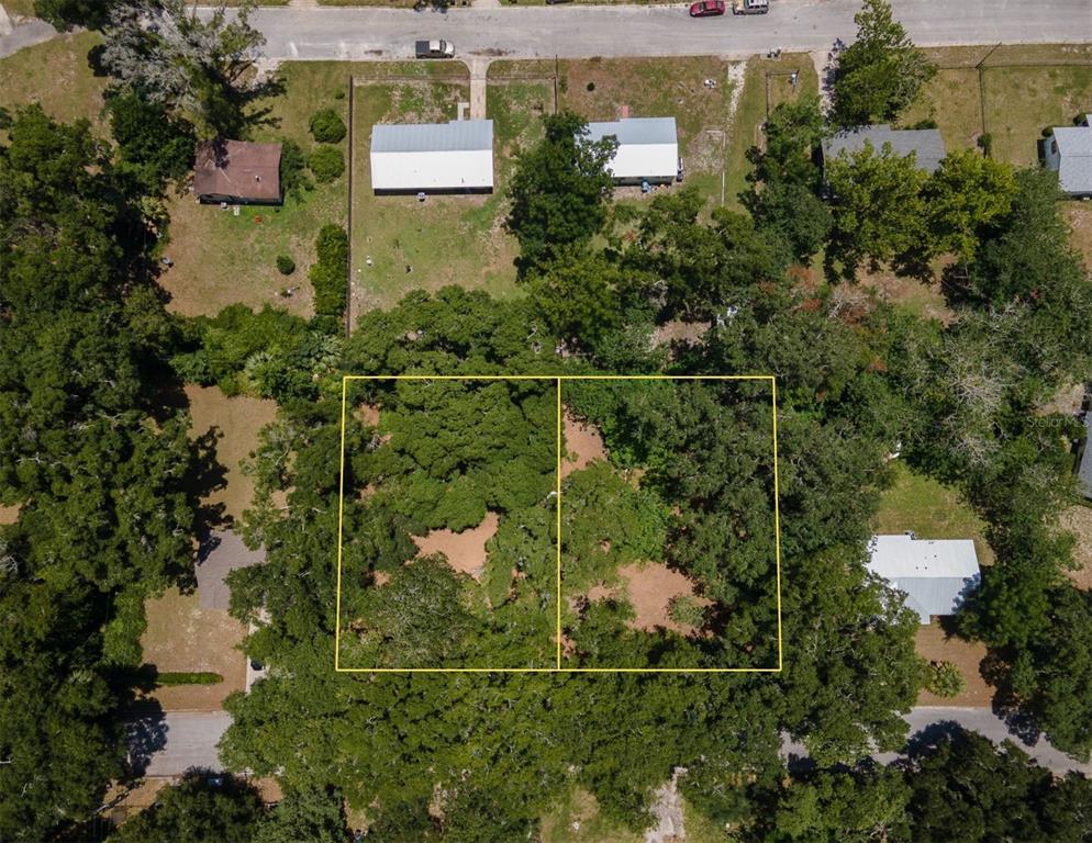 1805 Southeast 47 Terrace Gainesville, FL 32641 - Photo 2 of 9 an aerial view of a house with a yard