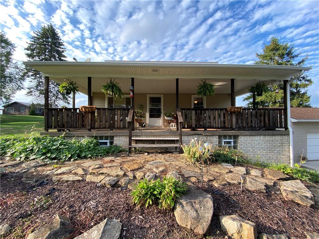 This covered front porch is the PERFECT spot for quiet relaxation or hosting family/friends!