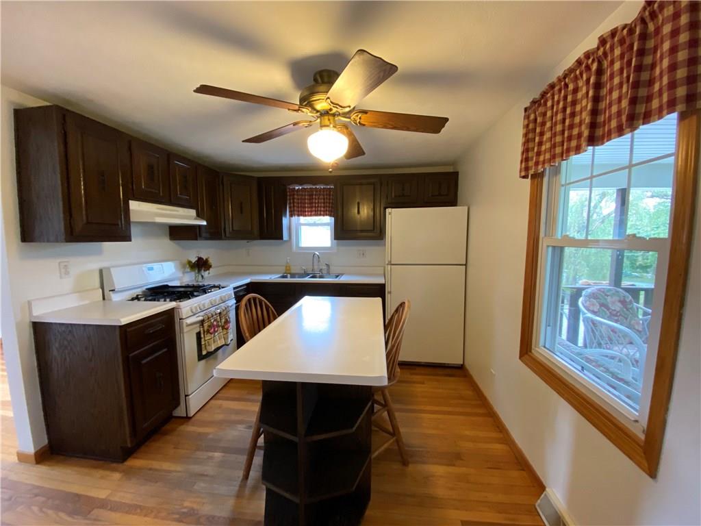 Eat-in-kitchen overlooks the covered porch/front yard 