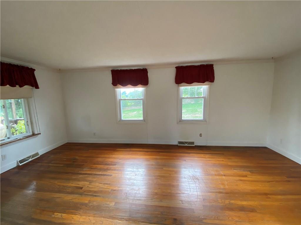 322 Thompson Run Road Ellwood City, PA 16117 - Photo 9 of 25 Living Room is very large with beautiful hardwood floors