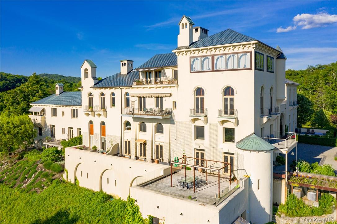 a front view of a building with a yard