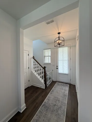a view of entryway with wooden floor