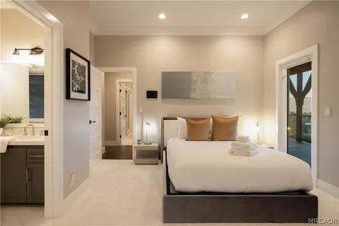 a large white bed in a white room
