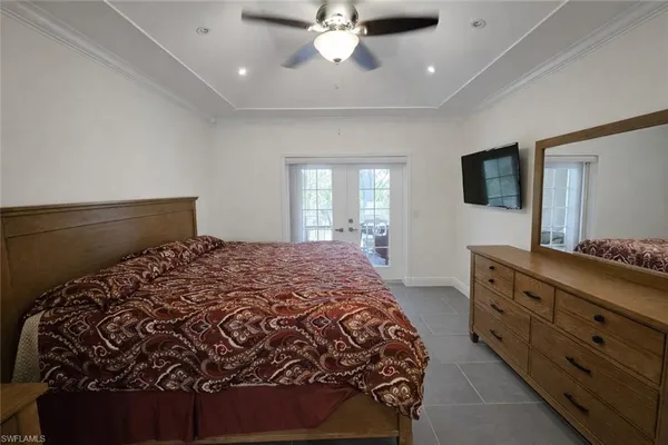 a bathroom with a granite countertop sink a toilet and a shower