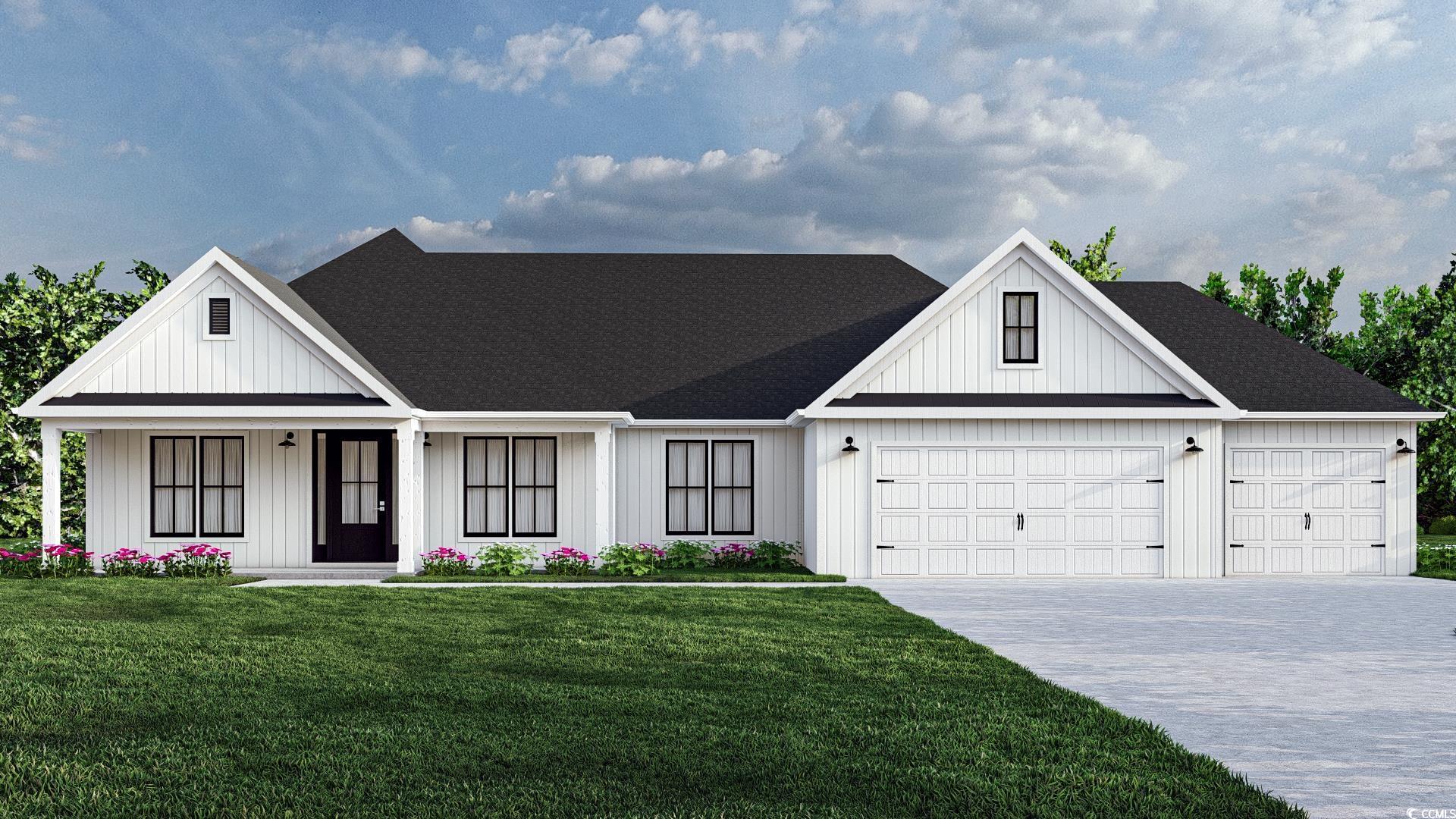 2180 Pettus Way Surfside Beach, SC 29575 - Photo 1 of 5 View of front of house with a front yard and a garage