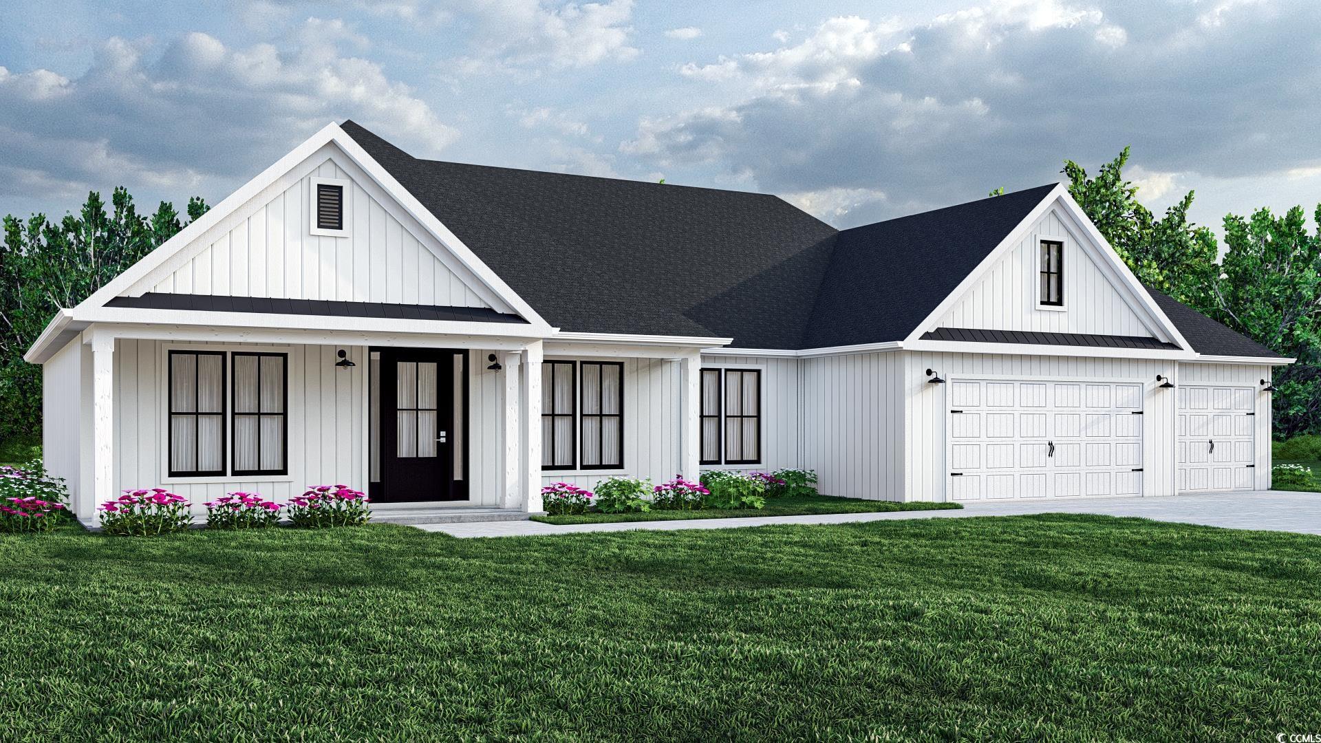 2180 Pettus Way Surfside Beach, SC 29575 - Photo 2 of 5 View of front of home featuring a front lawn and a garage