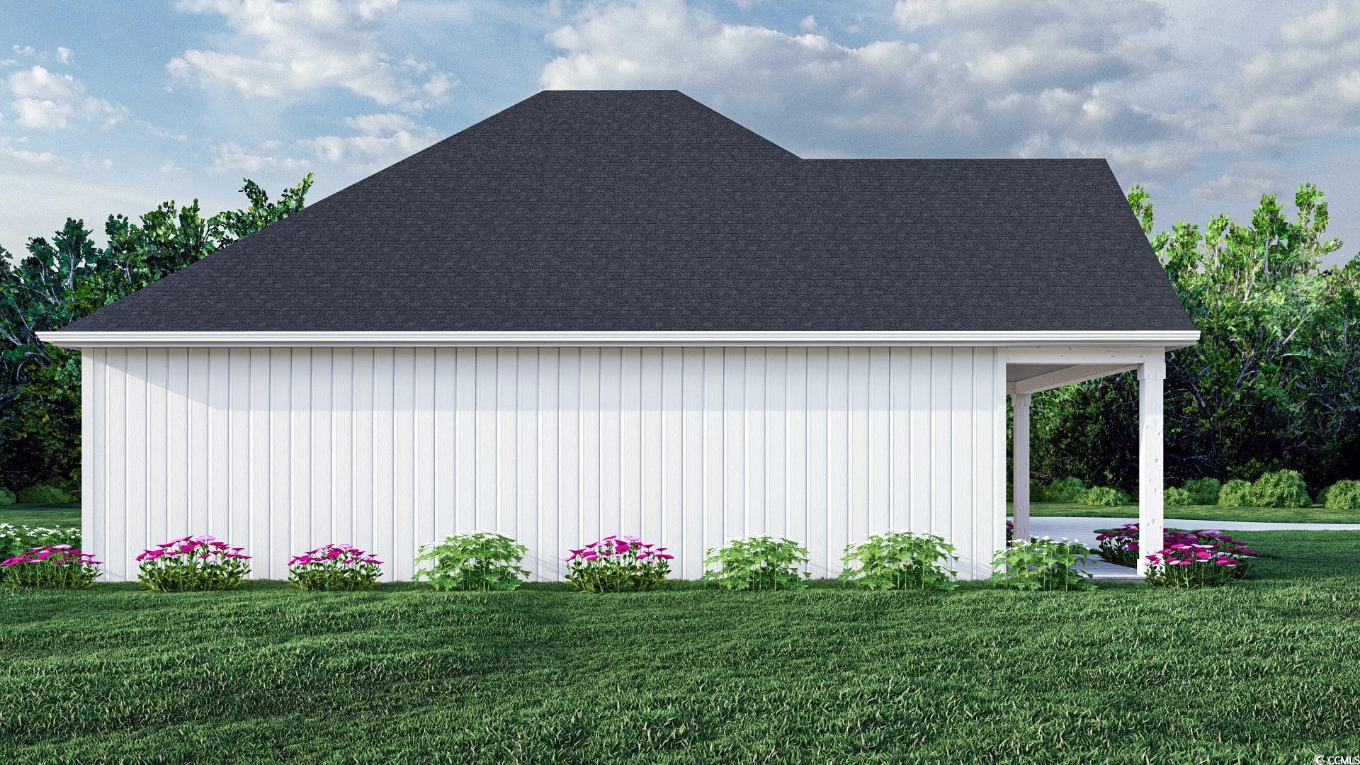 2180 Pettus Way Surfside Beach, SC 29575 - Photo 3 of 5 View of home's exterior featuring a yard