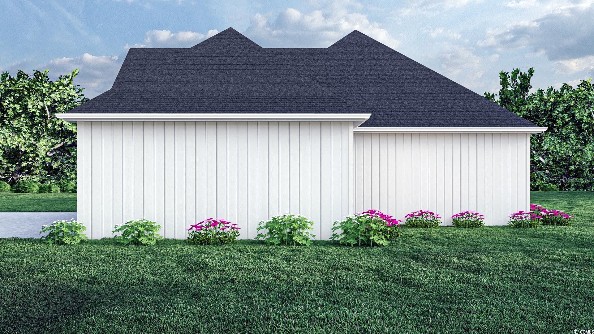 2180 Pettus Way Surfside Beach, SC 29575 - Photo 5 of 5 View of side of home with a lawn