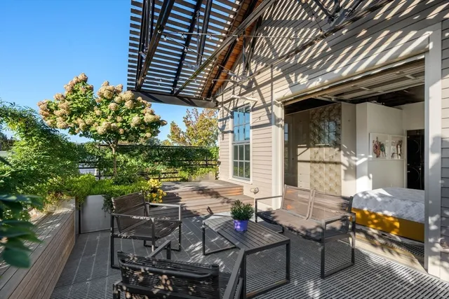 a view of backyard with outdoor seating