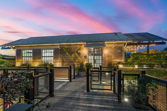 a view of a chairs and table in patio