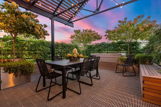 a patio with table and chairs