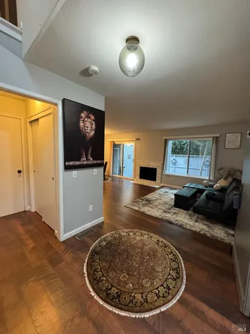 a view of a livingroom with furniture and staircase