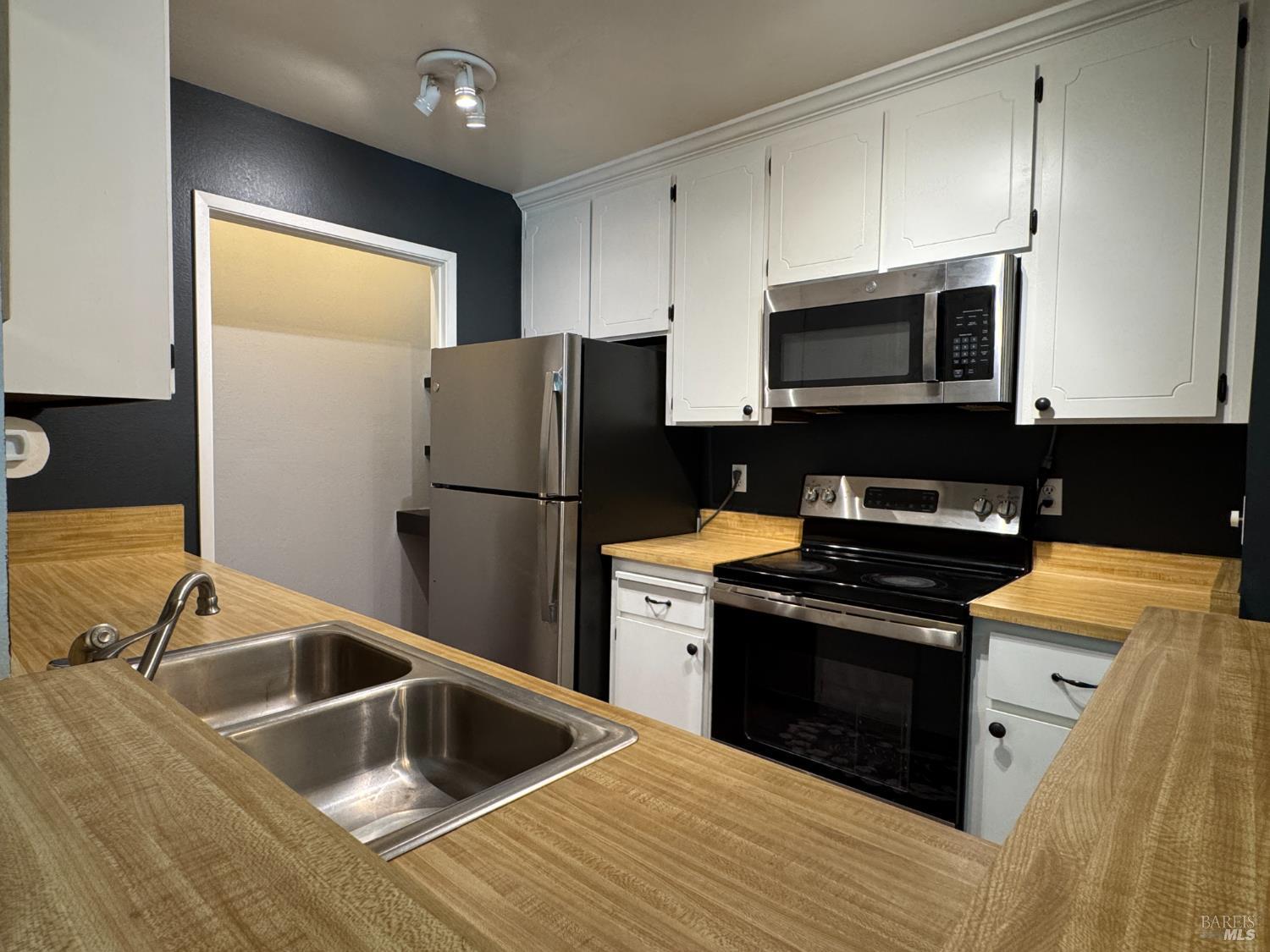 58 Scottsdale Way Novato, CA 94947 - Photo 16 of 64 a kitchen with a sink stove and refrigerator