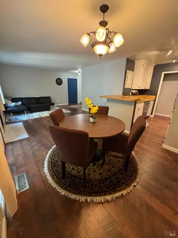 a spacious bedroom with a bed window and a flat screen tv