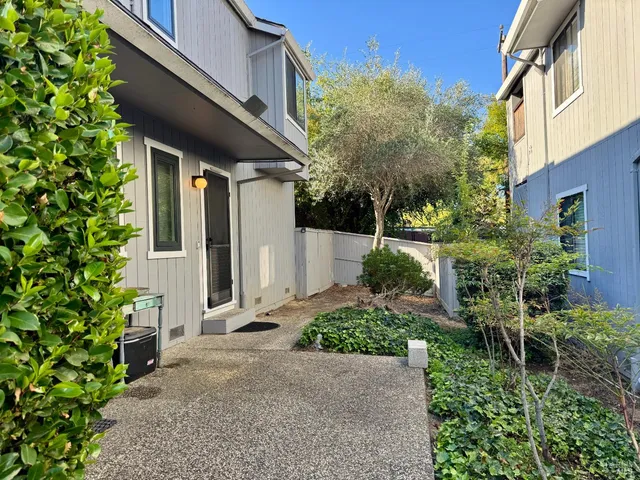 a backyard of a house with lots of green space