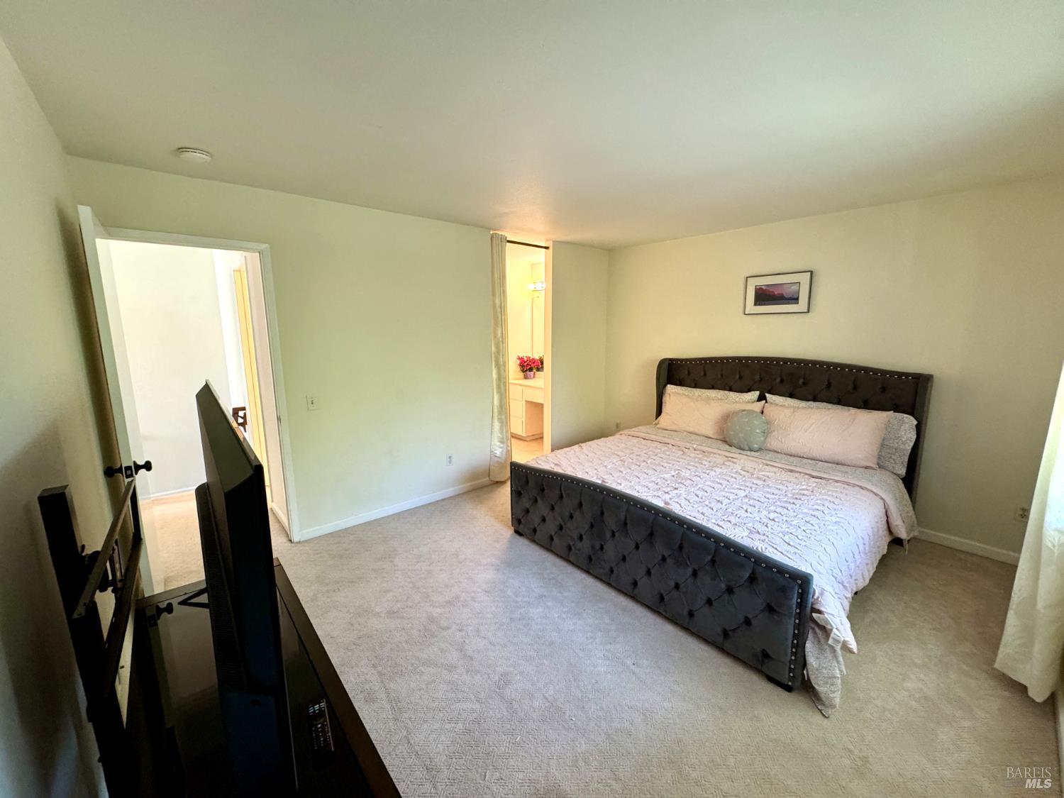 58 Scottsdale Way Novato, CA 94947 - Photo 33 of 64 a bedroom with a bed and a dresser next to a window