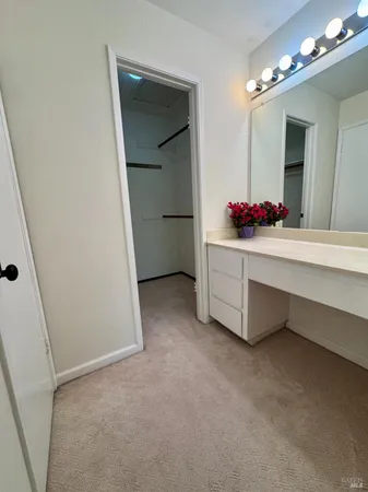 a bedroom with a bed and a chair