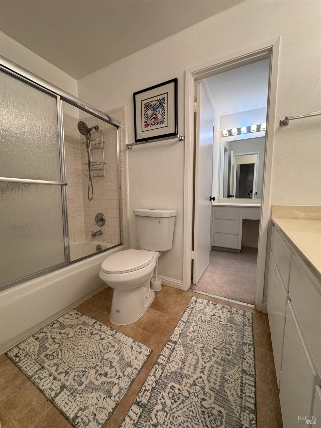 58 Scottsdale Way Novato, CA 94947 - Photo 41 of 64 a bathroom with a toilet a sink and shower