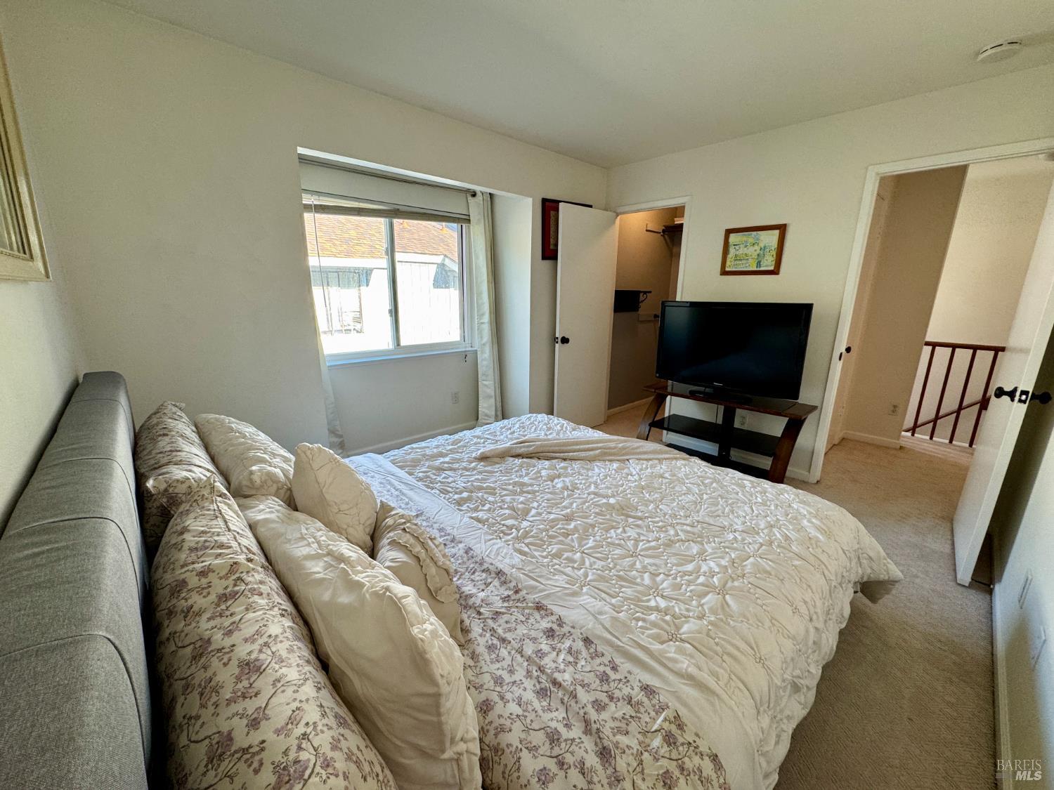 58 Scottsdale Way Novato, CA 94947 - Photo 45 of 64 a bedroom with a bed a mirror on dresser and a window