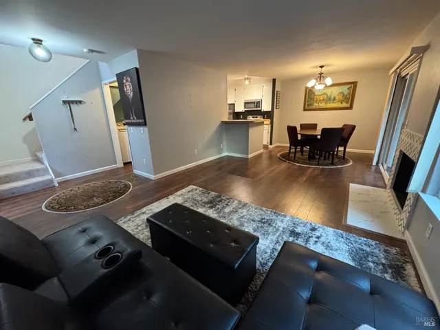 a living room with dining table