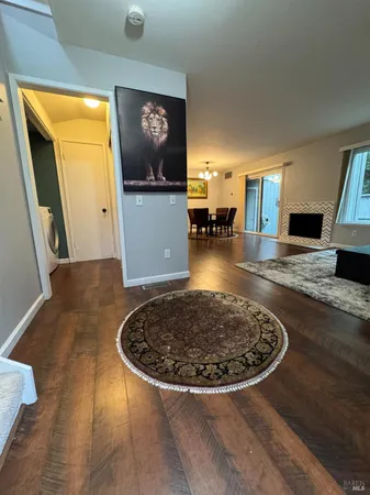 a view of a livingroom with couch and wooden floor