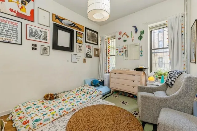 a bedroom with furniture and a window