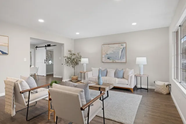 a view of a chair and tables in the patio