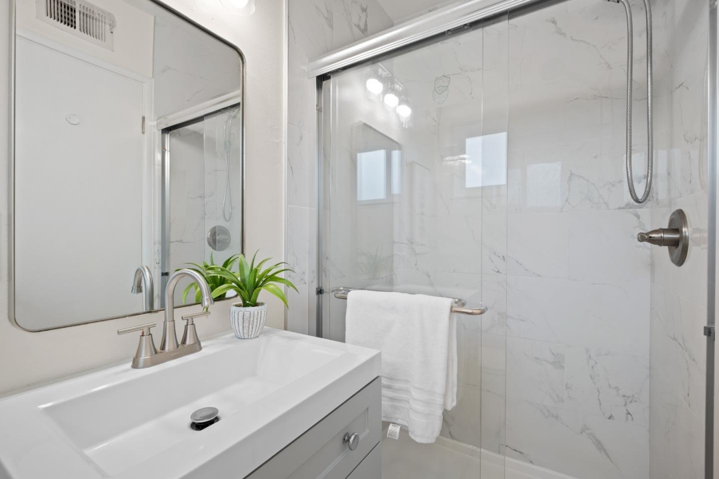 1732 Fallbrook Avenue San Jose, CA 95130 - Photo 33 of 54 a bathroom with a sink and a mirror