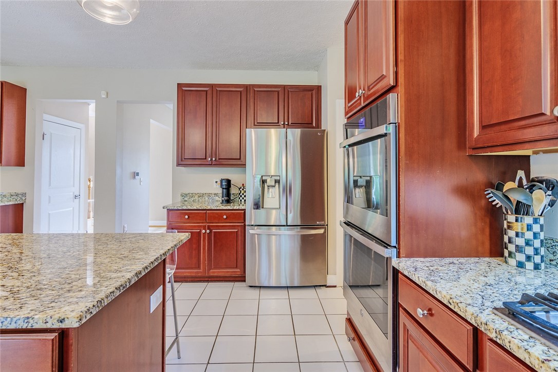 320 Sunningdale Rise Webster, NY 14580 - Photo 12 of 50 Cherry Cabinetry and GRANITE COUNTERS!!