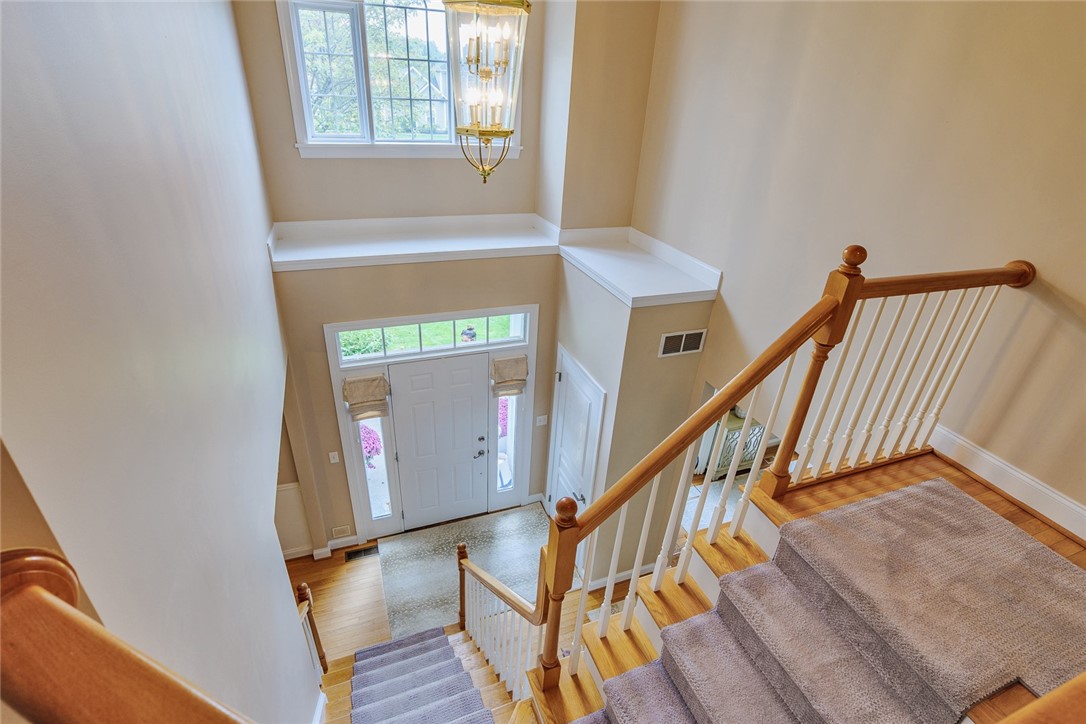 320 Sunningdale Rise Webster, NY 14580 - Photo 27 of 50 A view out onto the sun soaked foyer and solid woo