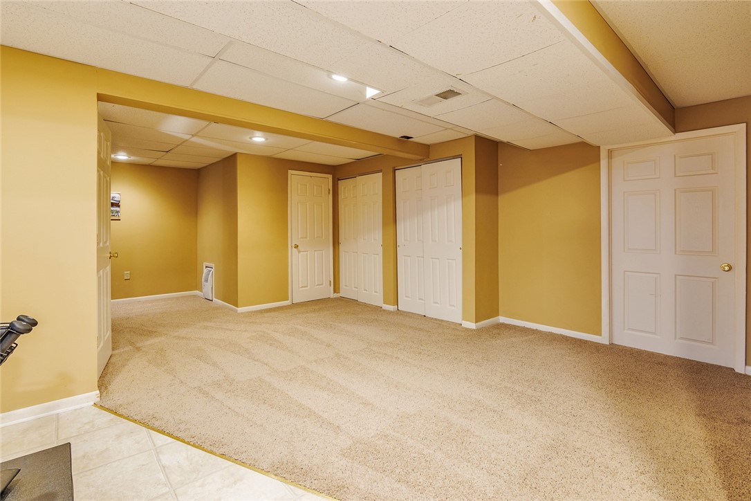 320 Sunningdale Rise Webster, NY 14580 - Photo 44 of 50 THE LIVING SPACE IN THE BASEMENT CONTINUES!